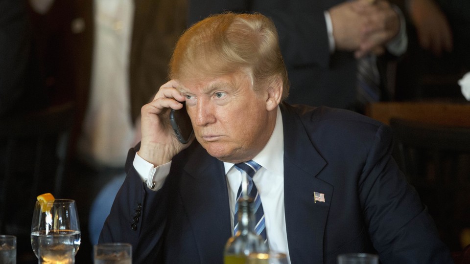 President Trump speaks on an iPhone