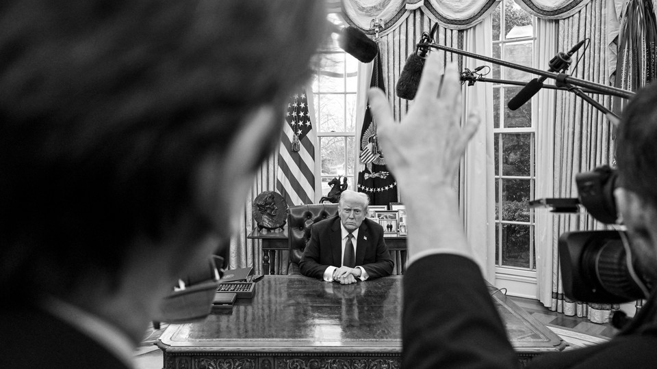 A reporter asks Donald Trump a question in the Oval Office.