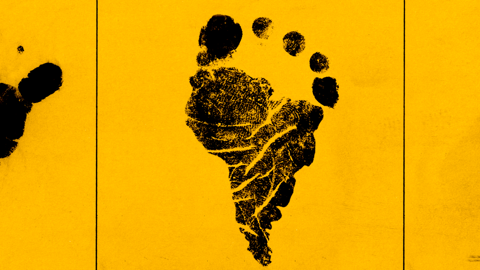 A black footprint on a yellow background