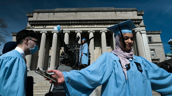 Seniors at Columbia University taking graduation photos on March 15, 2020.