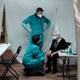 A woman speaks with health providers at a vaccination center in France.
