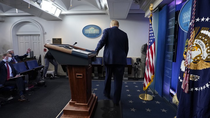 The president leaves the White House briefing room.