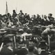In a rare image of President Lincoln at Gettysburg, he is shown hatless at the center of a crowd on the orators’ platform.
