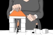one person in a building block house, while another sits out, and the house is being built by a woman