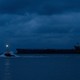An oil tanker at night