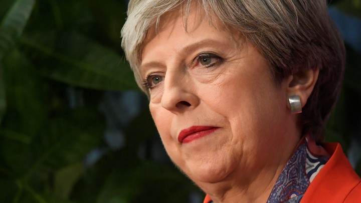 Prime Minister Theresa May waits to speak after retaining her seat.