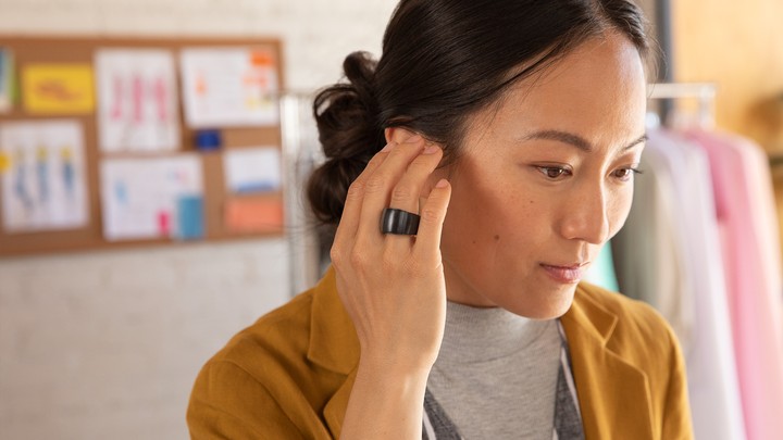 A marketing photo of a woman wearing an Amazon Loop