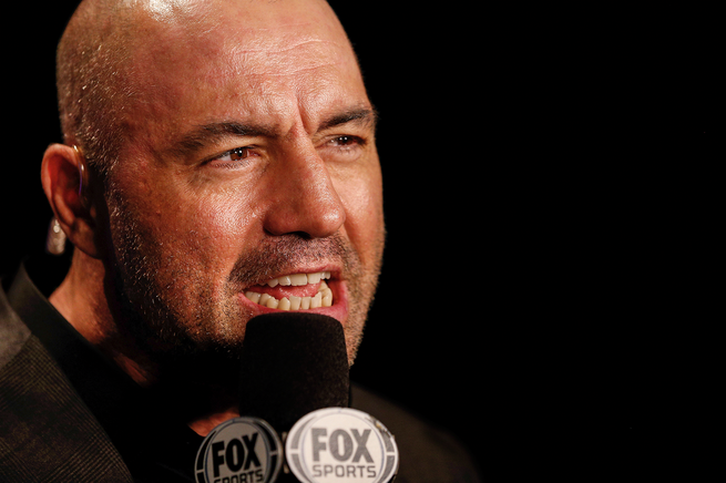 photo of Joe Rogan speaking into microphone with "FOX" on it 