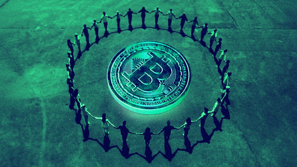 People hold hands and surround a giant bitcoin