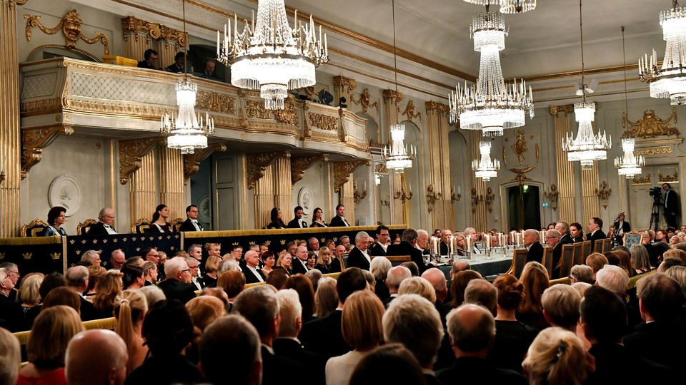 People sitting in a ballroom