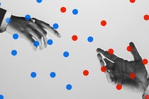 Two hands reaching toward each other, surrounded by blue and red dots