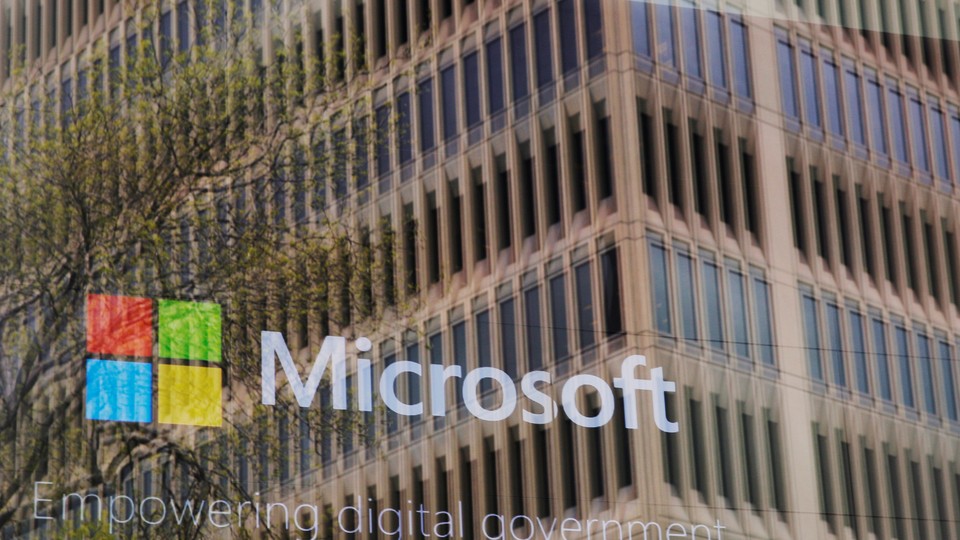 The Microsoft logo reflected in a window