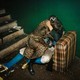 Two people kissing on a couch in a dirty room