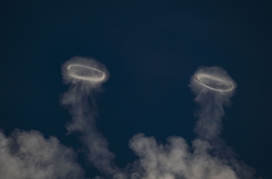 Two rings of steam rise into the sky.