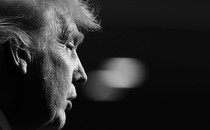 Black-and-white photograph of Donald Trump in profile from the right, with the background out of focus