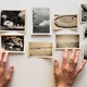 Amelia Walker's hands hover over her collection of snapshots.