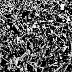 Football fans cheering as the University of Kansas Jayhawks score two touchdowns during a game against Syracuse, winning the game