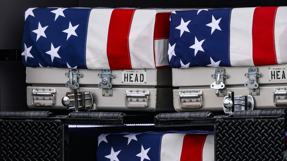 Dignified transfer cases belonging to Major Jeffery R. OBrien, Captain Cody A. Khork, and Sergeant First Class Nicole M. Amor during a dignified transfer at Dover Air Force Base in Dover, Delaware, US, on Saturday, March 7, 2026