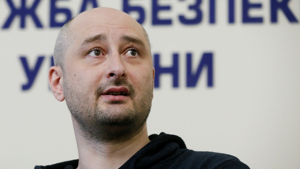 Arkady Babchenko speaking at a news conference
