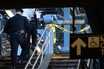 A police officer on a subway staircase