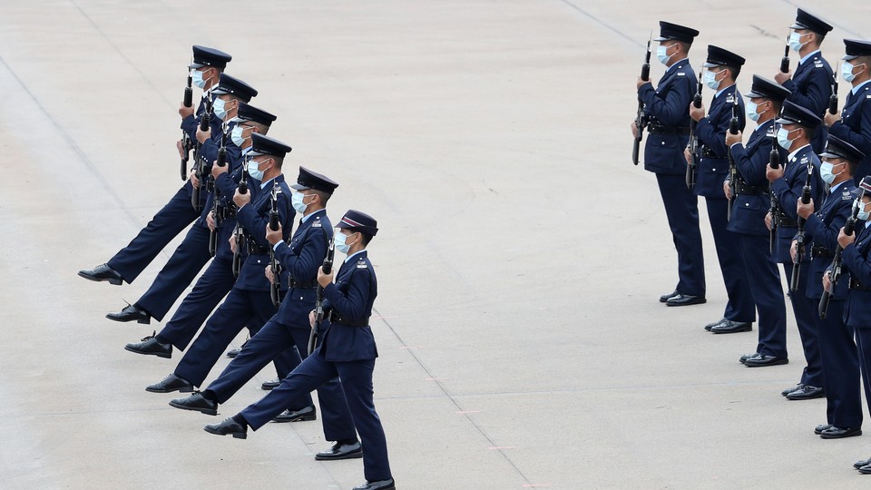 Goose-stepping police officers