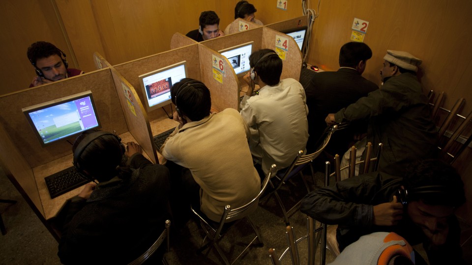 People in an internet cafe in Pakistan