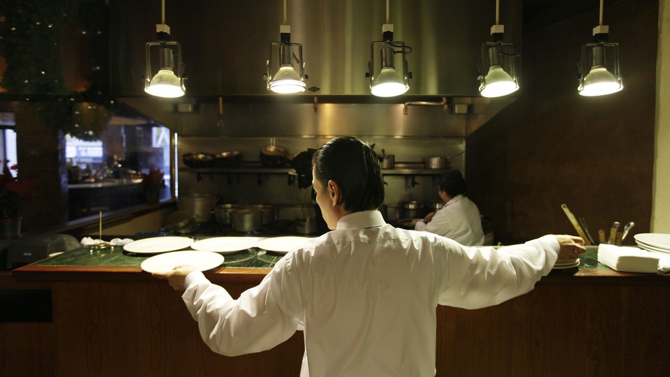 A waiter at a restaurant