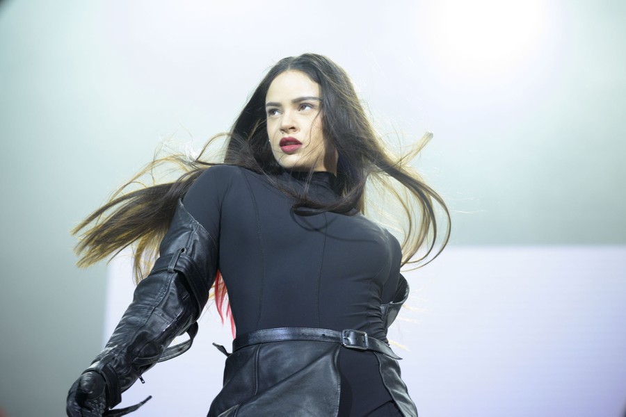 A performer onstage, turning her head to the right