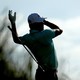 The professional golfer Gary Woodland loses grip of his club during a swing.