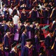 Tsinghua University graduates attend their commencement ceremony in caps and gowns.