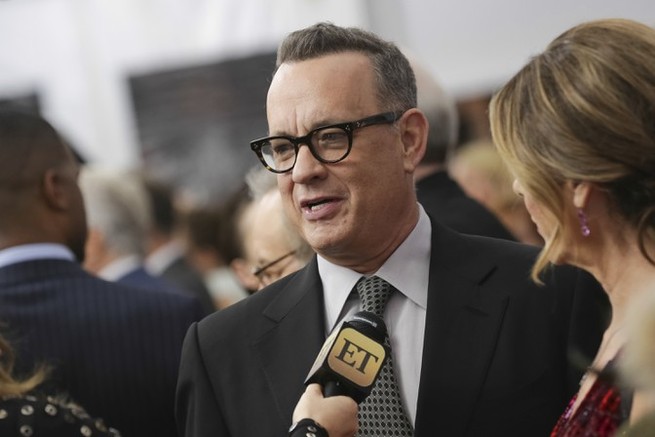 Tom Hanks speaks to an ET reporter
