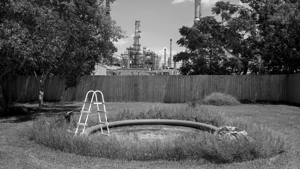 A Valero refinery behind the backyard of a house in Chalmette, Louisiana