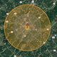 A satellite map with a pin, marked with the atomic symbol, and concentric circles over Charlottesville