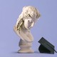 photo illustration of a bust and a graduation cap