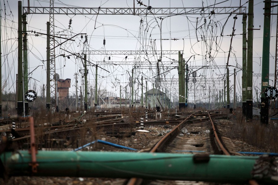 War-damaged railroad tracks and power lines