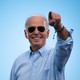 Joe Biden gestures to a crowd before delivering remarks at a drive-in rally in Coconut Creek, Florida.