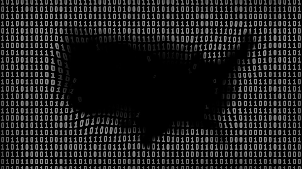 Silhouette of the United States over a background of ones and zeros