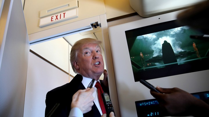 Donald Trump speaks on board Air Force One on Thursday