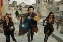 Three people race across a courtyard in "Dungeons & Dragons: Honor Among Thieves."