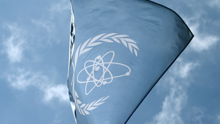 The flag of the IAEA flies in front of its headquarters in Vienna