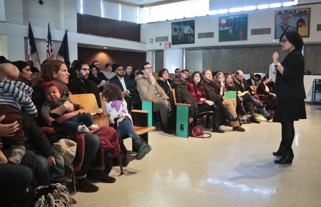 Principal Sandra Soto, far right, of Public School 705, Brooklyn Arts and Science elementary school, addresses a gathering of parents a on tour of the school in the Brooklyn borough of New York. Gentrification has been coming fast to the school's Crown Heights neighborhood, with the influx of wealthier, white residents being reflected in the hallways, but a pilot program will let PS705 and six other New York City elementary schools tweak their admissions policies to foster diversity by setting aside spots for low-income kids.