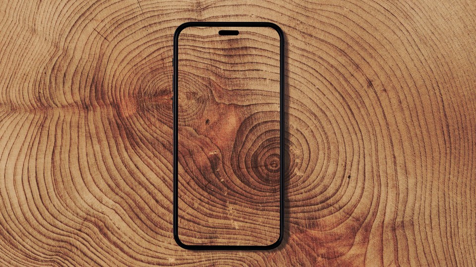 A transparent phone against a wood-grain background