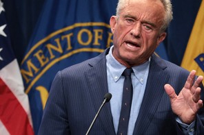 RFK Jr. speaks at a podium.