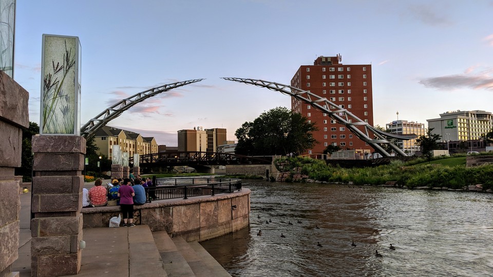 The new 'Arc of Dreams' sculpture over the Big Sioux River in downtown Sioux Falls, South Dakota, in July 2019, shortly before its formal unveiling.