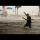 A man tries to move through floodwater during Hurricane Helene.