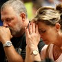People pray during a vigil for the victims of a mass shooting in Las Vegas.
