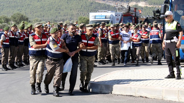 Soldiers accused of attempting to assassinate President Erdogan on the night of the failed coup are escorted to court on July 13, 2017.