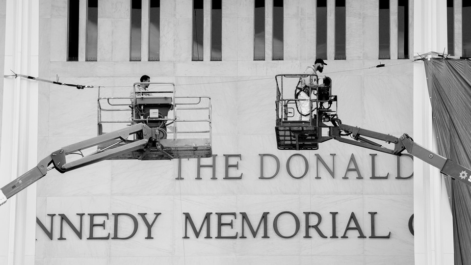 Workers rename the Kennedy Center