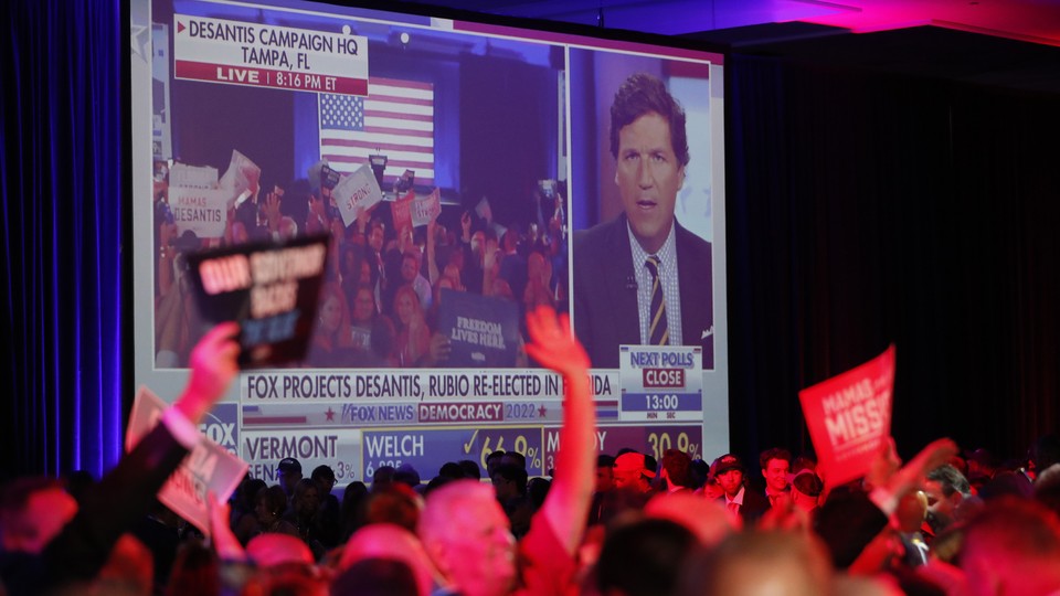 Supporters of Governor DeSantis celebrate his victory during his Election Night watch party at the Tampa Convention Center on November 8, 2022.