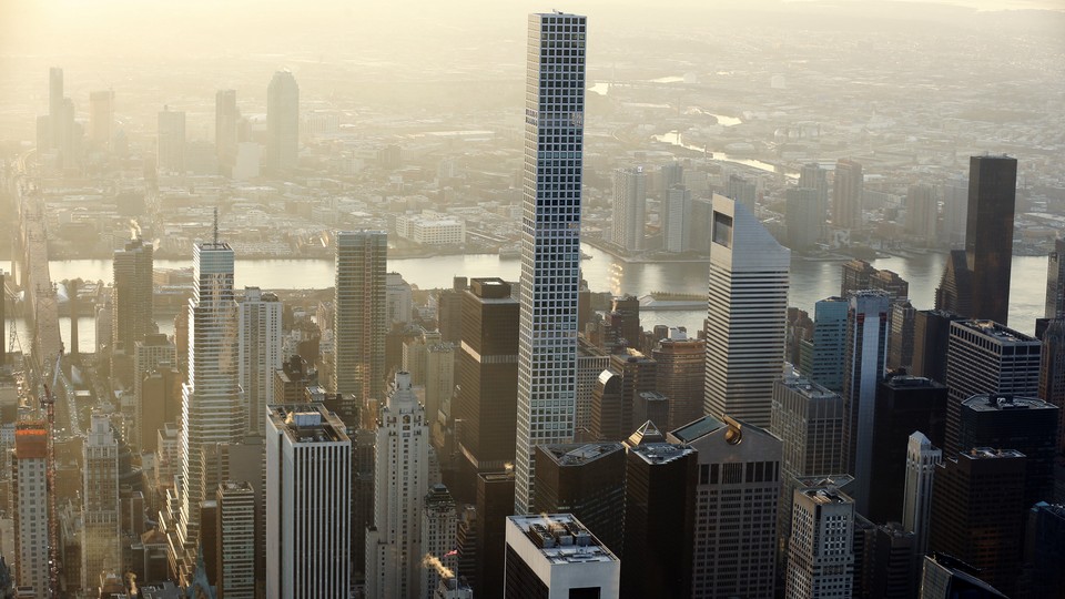 432 Park Avenue, an apartment building in Manhattan, towers over its neighbors. Most of its units are priced in the tens of millions of dollars. 